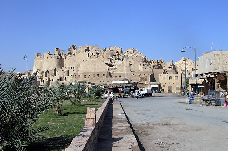 The mudbrick ruins of the Shali fortress in Siwa Oasis at day's end